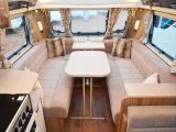 There's a handy storage space at the end of the kitchen unit, just one of many neat, luxury touches in this six-seat lounge – it's a pity the freestanding table is stored at the back of the van, though