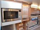 A microwave and cocktail cabinet are nice additions in this Swift caravan