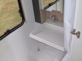 The washroom in the Adria Action is small, but a fold-down sink helps optimise what space there is