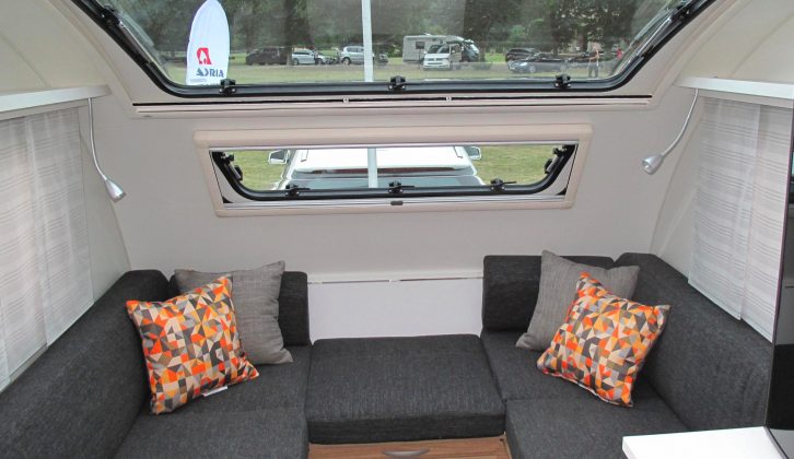 The modern, Brunello Black upholstery gets a splash of colour thanks to these bright cushions, the sunroof also letting lots of light in