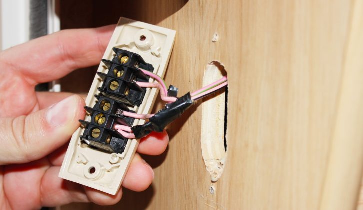 Next, disconnect and remove the old light switch, making note of where each wire went