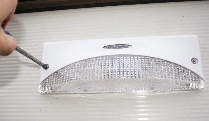 Loosely attach the new light unit before feeding the wires into the new trunking