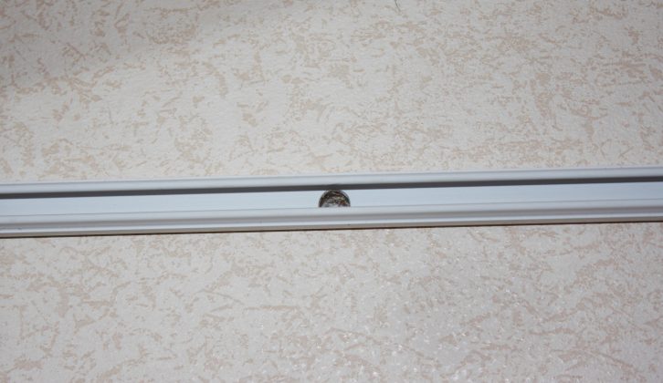 Add new trunking inside the caravan behind the light, and drill an 8mm hole for the wires