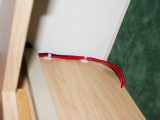 Secure the light switch and tidy up the cabling in the dresser with cable-ties