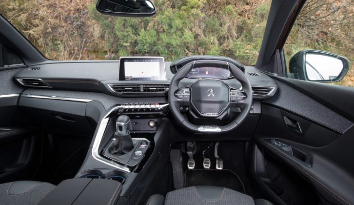 The cabin is stylish with a small steering wheel, while the touchscreen is mounted high so the driver doesn’t have to take their eyes far from the road to see it