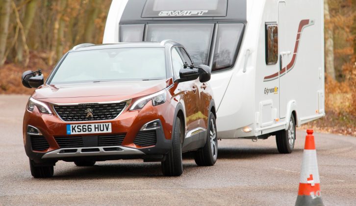 The 3008’s body leans a bit and the steering is light, but there was never any sense that the car was being overwhelmed by the caravan