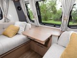 Bright scatter cushions and attractive curtains lift the lounge of the 2018-season VIP 675