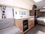 The kitchen of this Adria caravan is clean, modern and well equipped, with decent storage and soft-close drawers