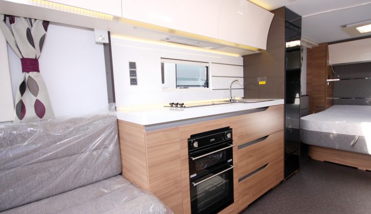 The kitchen of this Adria caravan is clean, modern and well equipped, with decent storage and soft-close drawers