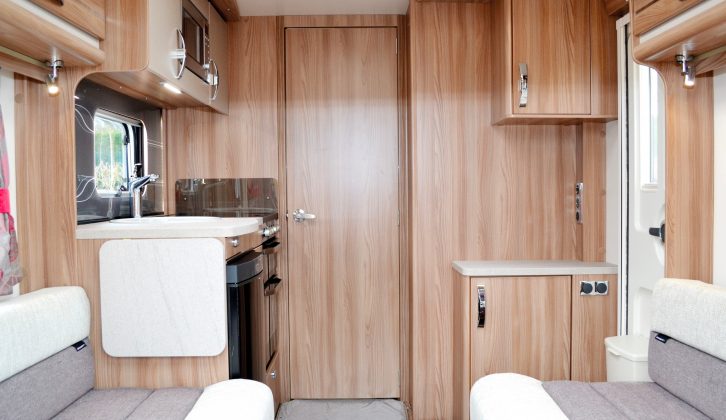 Aerial, 12V and mains points are located above a shallow cupboard by the entrance door – there are no USB sockets in this Swift caravan