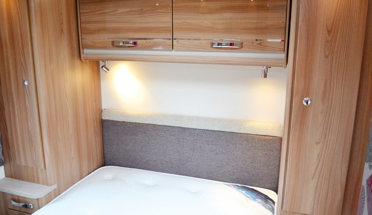Narrow wardrobes – that on the nearside houses the table – flank the bed, with drawers topped by a small bedside table and lockers overhead, while the end bedroom is well lit