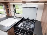 The drop-down cover for the Thetford dual-fuel hob boosts worktop space significantly
