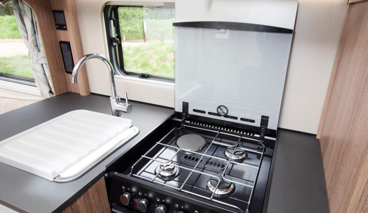 The drop-down cover for the Thetford dual-fuel hob boosts worktop space significantly