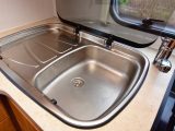The stainless-steel sink with integrated drainer also features a glass top that can be used as extra work surface