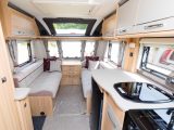 An angle in the roof locker doors gives the feeling of more headspace in the lounge of this Coachman caravan