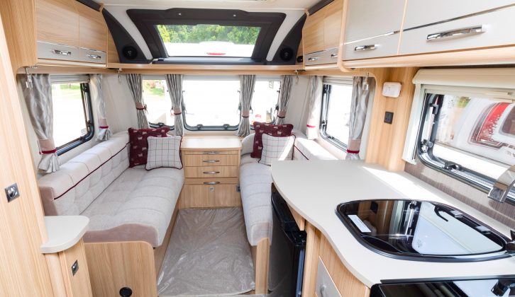 An angle in the roof locker doors gives the feeling of more headspace in the lounge of this Coachman caravan