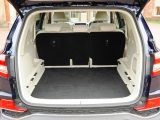 In a five-seat Rexton, boot space with the seats down is 1977 litres, 820 litres with the seats up, measured up to window level.