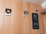 It's good to have a pair of coat hooks by the door – this is also where you'll find the control panel