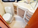 There’s a manual-flush loo and the moulded vanity unit offers good storage in the compact washroom – the shower cubicle is separate