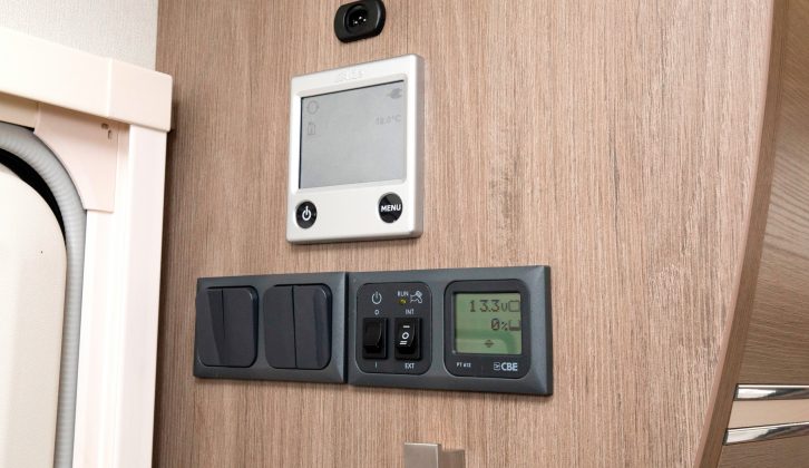 The control panels and switches are easy to reach inside the Compass Camino 674's entrance door