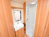 A large wardrobe and shower feature in the Bailey Olympus 460-2’s end washroom, which also has a Thetford electric-flush loo