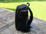 Store accessories in the two side compartments of this Manfrotto backpack