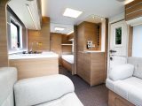 The kitchen is sited in the centre of the caravan – drop-in carpets are included in UK models