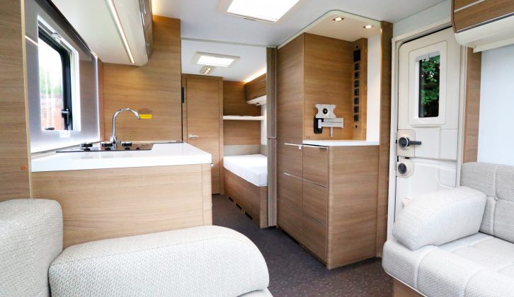 The kitchen is sited in the centre of the caravan – drop-in carpets are included in UK models