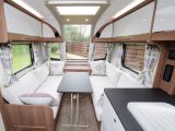 The freestanding lounge table is stored in the bedroom of this 2018 Bailey Unicorn Valencia