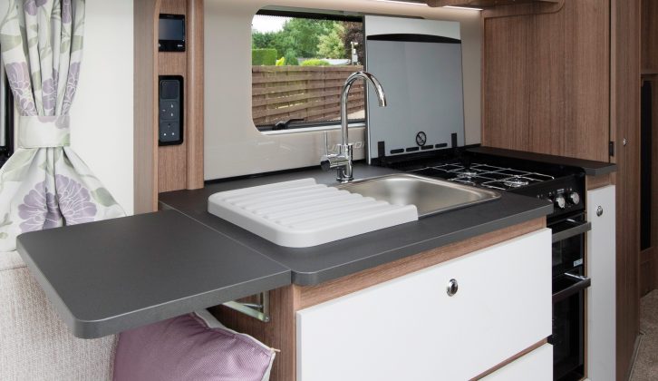 We love these three deep drawers, but not how the wooden hob over obstructs the window when raised