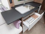 There's also a lift-up worktop flap, a drainer and a cutlery holder in this kitchen