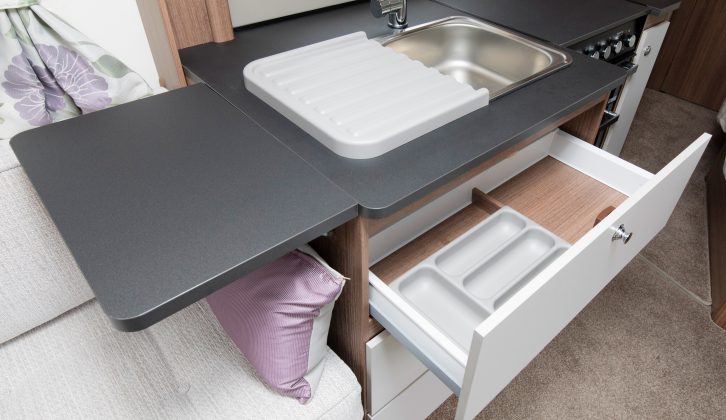 There's also a lift-up worktop flap, a drainer and a cutlery holder in this kitchen