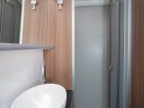 The large separate shower cubicle in the 2018 Bailey Unicorn Valencia has its own rooflight and a fold-down clothes-drying rail