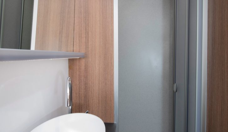 The large separate shower cubicle in the 2018 Bailey Unicorn Valencia has its own rooflight and a fold-down clothes-drying rail