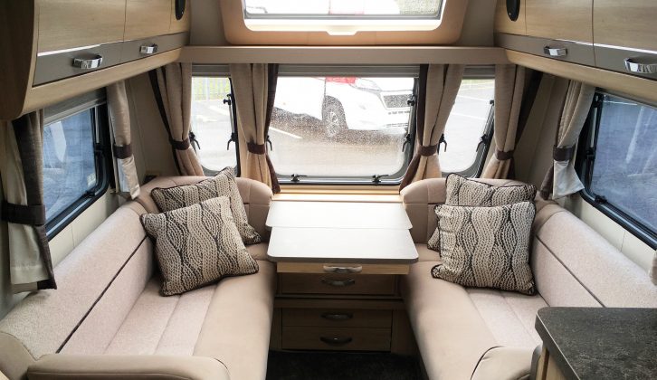 The large central window, sunroof and stargazer rooflight provide plenty of daylight in the lounge of this Elddis caravan