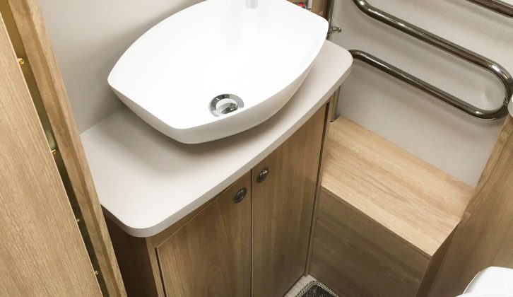 The offside part of the washroom has a rooflight, an Alde radiator and a salad-bowl sink