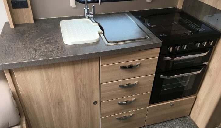 There's a granite-effect worktop, two mains sockets, a separate oven and grill, and a microwave in the offside kitchen
