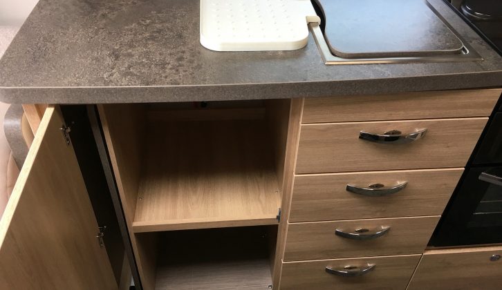 Four drawers under the sink and this shelved cupboard are just part of the generous kitchen storage space