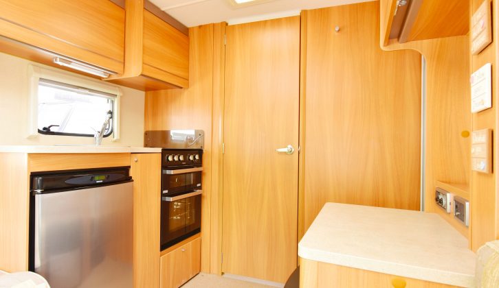 The side kitchen boasts a fridge and a separate oven and grill, and there’s a socket in the top-right locker for a microwave, plus more worktop opposite