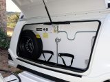 The corner steady winder is stowed above the gas bottles in this 2018 Caravelair Antarès 406