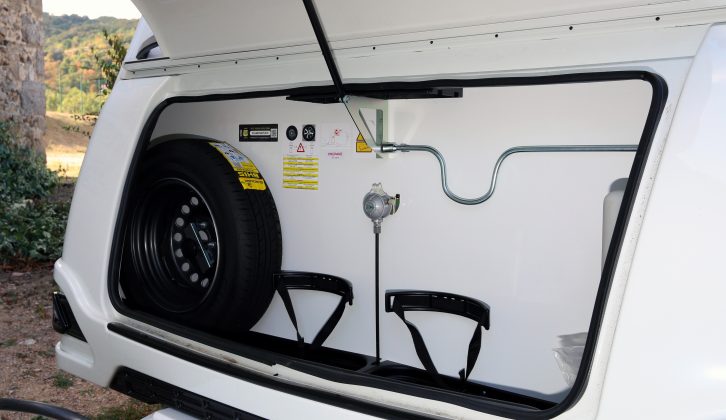 The corner steady winder is stowed above the gas bottles in this 2018 Caravelair Antarès 406