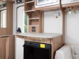 Opposite the main kitchen is yet more work space, as well as a fridge/freezer and a microwave