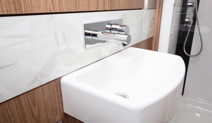 The handbasin's concealed tap is a very smart feature in this caravan's end washroom