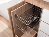 Open the left-hand lower cupboard to reveal this wire racking to help organise your groceries