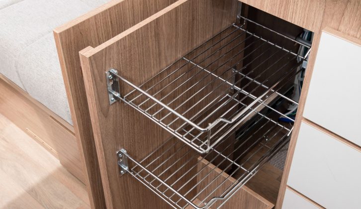Open the left-hand lower cupboard to reveal this wire racking to help organise your groceries