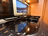 The sink has a built-in drainer – some might find the worktop too dark and dated