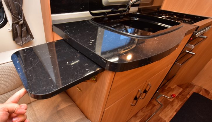 The kitchen's worktop has an extension flap, but it needs to be larger and flush fitting