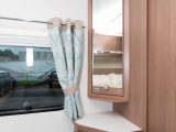This vanity unit sits on the nearside in the master bedroom and provides a mirror, storage and sockets