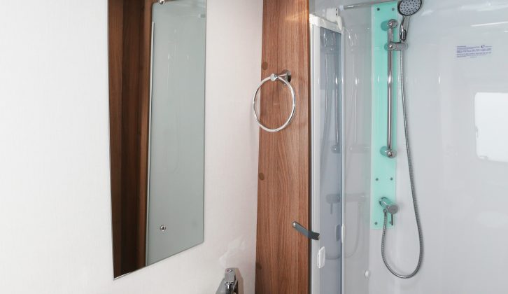 The lined shower cubicle is a good size, as are the sink and mirror – storage provision is ample