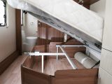 The fixed bed lifts up to provide access to a capacious storage area